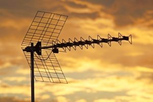 TV antenna with a sunset backdrop.